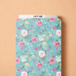 Delicate floral design featuring soft pink, white, and pale yellow blossoms with elegant green foliage on a fresh sky-blue background.