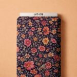 Warm coral and orange florals with muted green leaves on a deep navy background.