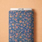 Delicate peach and blush florals scattered across a rich blue background.