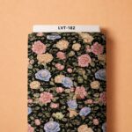 Elegant pastel roses in pink, peach, and soft blue over a rich black background.