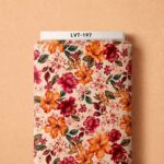 Vibrant orange and crimson florals with deep green leaves on a soft cream background.