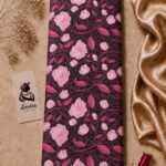 Premium printed silk fabric featuring elegant pink floral blooms on a rich dark plum background-Italian Silk (ST01)