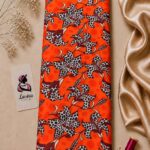 Vibrant floral pattern with spotted petals and rich burgundy details on a bold orange background-Italian Silk (ST01)