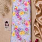Delicate floral print featuring colorful blossoms on a soft sky blue background- Italian Silk (ST01)