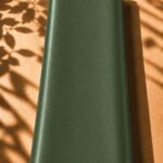 Refined plain silk in a deep olive green shade, offering a rich look with understated elegance.