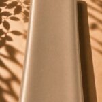 Luxurious plain silk in a warm golden beige shade, offering a graceful drape and timeless elegance.