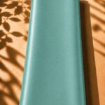 Luxurious plain silk in a soft aqua blue shade, with a smooth texture and elegant sheen.