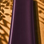 Luxurious plain silk in a deep plum shade, with a smooth texture and elegant sheen.