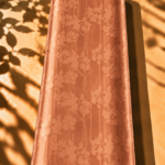 Graceful blossoms unfold across slender vertical accents in a warm peachy nude shade - Jacquard Silk (JD08x2)