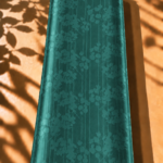Flowing floral branches create a graceful look over fine vertical lines in a rich emerald teal shade - Jacquard Silk (JD08x2)