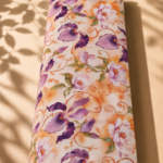 Elegant Spanish cotton with artistic purple florals, soft ivory tones and warm orange accents - Spanish Cotton (PC11)
