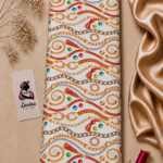 Elegant ivory Italian silk with luxurious gold and bronze chains, red strap details and colorful jewel accents - Italian Silk (ST01)