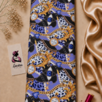 Luxurious Italian silk with bold blue and black animal-inspired patterns, ornate gold chains, watches and jewel details - Italian Silk (ST01)