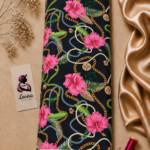 Vibrant pink flowers, gold chains, and tropical leaves on a black background – Silk Jacquard (JD02)