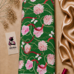 Elegant floral and chain design featuring soft pink flowers, red straps, delicate gold chains, and white butterflies on a rich green background – Silk Jacquard (JD02)