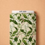 Delicate white bell-shaped blossoms with lush green leaves and subtle pink accents on a soft cream background.