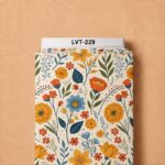 Playful botanical floral print with warm orange and golden blooms, soft blue flowers, and fresh green foliage on a creamy background.