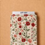 Elegant red, coral, and ivory floral print with delicate green leafy stems on a soft cream background.