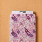 Elegant pink ornamental print featuring interlocking chains, decorative knots, tassels, and rich purple accents.