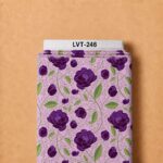 Rich purple floral print with fresh green leaves and delicate winding vines on a soft lavender background.