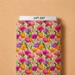 Vibrant multicolor tulip floral print in pink, magenta, purple, and orange with fresh green leaves on a soft cream background.