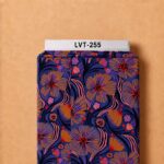 Bold artistic floral print with orange, pink, purple, and red accents on a deep navy background.
