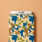 Bold abstract botanical pattern with flowing ivory shapes in rich blue, olive green, and warm brown tones