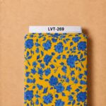 Elegant blue floral pattern with detailed blossoms and flowing leaves on a vibrant golden yellow background.