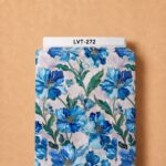 Elegant blue floral design featuring layered sapphire and sky-blue blooms with deep green foliage on a soft ivory background.