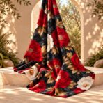 Dramatic floral design with bold red and ivory blooms, golden foliage, and deep charcoal leaves on a rich black background. - Image 2