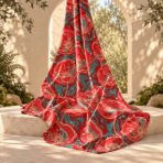 ⁦Bold artistic floral design with vivid red poppy-style blooms, turquoise accents, cream outlines, and scattered white details.⁩ - الصورة ⁦2⁩