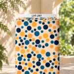Playful polka-dot design with varied circle sizes in navy, teal, and golden orange on a soft cream background.