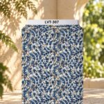 Elegant botanical print featuring delicate navy and soft blue blossoms intertwined with graceful branches on a warm ivory background.