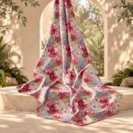 Vibrant all-over floral print featuring layered blossoms in pink, red, blue, ivory, green, and soft yellow tones. - Image 2