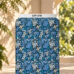 Delicate all-over floral print featuring clusters of tiny blue and white blossoms with subtle green and golden stems on a deep blue background.