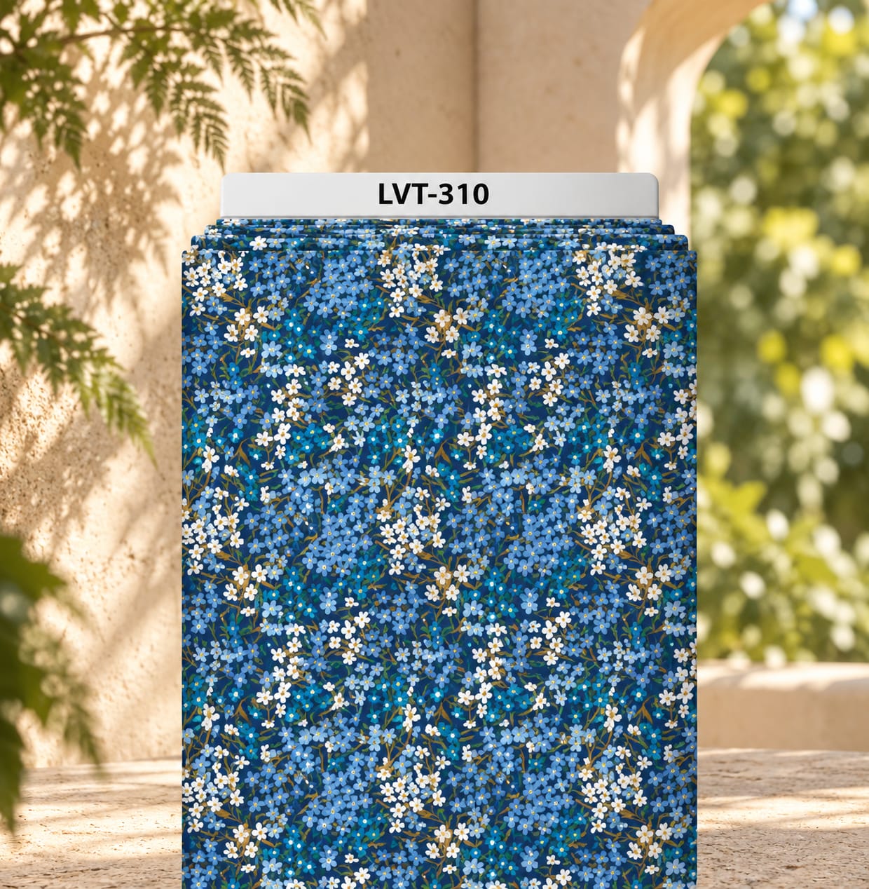 LVT-310 Delicate all-over floral print featuring clusters of tiny blue and white blossoms with subtle green and golden stems on a deep blue background. - Image 1