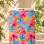 Vibrant watercolor floral print with pink and orange blooms, blue leaves, and yellow accents on a fresh aqua background.