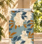 Elegant ivory floral print with deep blue and warm amber leaves on a soft dusty blue background.