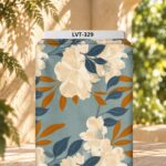 Elegant ivory floral print with deep blue and warm amber leaves on a soft dusty blue background.