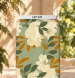 Elegant ivory floral print with deep green and warm amber leaves on a soft sage background.