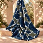 Bold navy floral silhouettes with crisp white outlines on a muted olive background. - Image 2