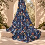 ⁦Folk-inspired florals in vibrant orange, blue, and pink on a deep navy background.⁩ - الصورة ⁦2⁩