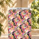 Vibrant swirling abstract pattern in pink, turquoise, yellow, peach, and black.