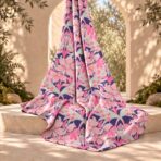 ⁦Elegant floral pattern in soft pink and mint tones over a deep purple background.⁩ - الصورة ⁦2⁩