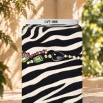 Bold zebra stripes accented with colorful jewel-inspired details.
