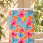 Vibrant watercolor florals in pink and orange with blue and yellow leaves on a turquoise background.