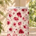 Romantic red and pink roses with soft beige leaves on a warm cream background.