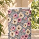 Soft pink and ivory floral design on a dusty blue background with delicate botanical leaves.