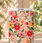 Vibrant colorful flowers and green leaves on a soft peach-pink background.