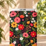 Vibrant red, pink and yellow flowers with green leaves on a deep black background.